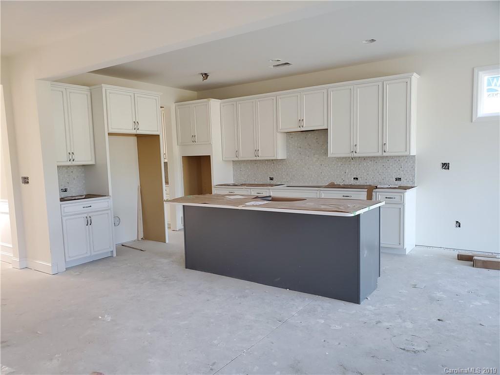 5505 Braddock Ml Way, Unit 273 Lancaster, SC 29720 - Photo 10 of 29 a kitchen with stainless steel appliances a refrigerator sink and white cabinets