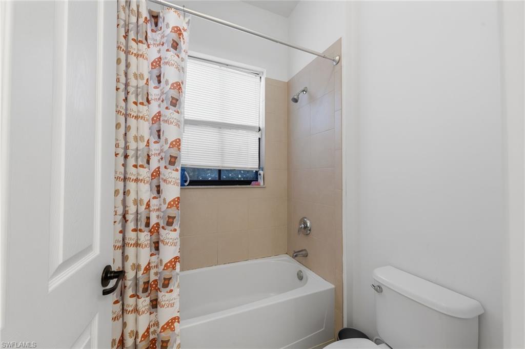 5172 Bergamo Way Ave Maria, FL 34142 - Photo 14 of 33 a bathroom with a bathtub and shower