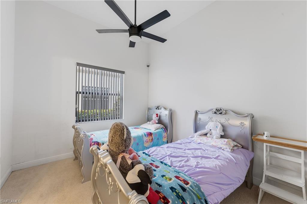 5172 Bergamo Way Ave Maria, FL 34142 - Photo 15 of 33 a bedroom with a bed and a window