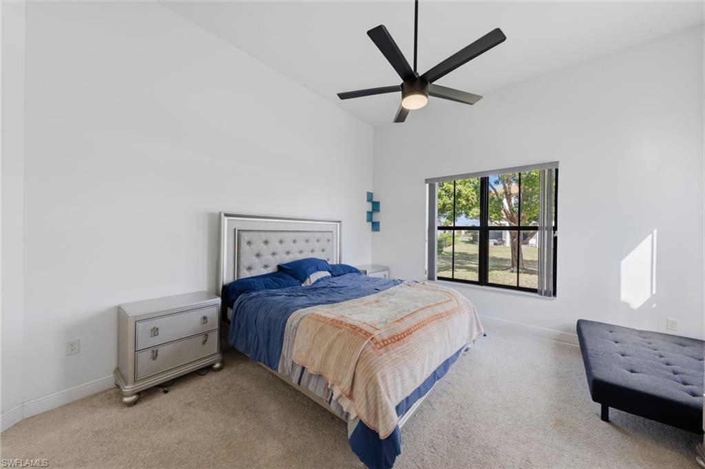 5172 Bergamo Way Ave Maria, FL 34142 - Photo 18 of 33 a bedroom with a bed a window and a dresser