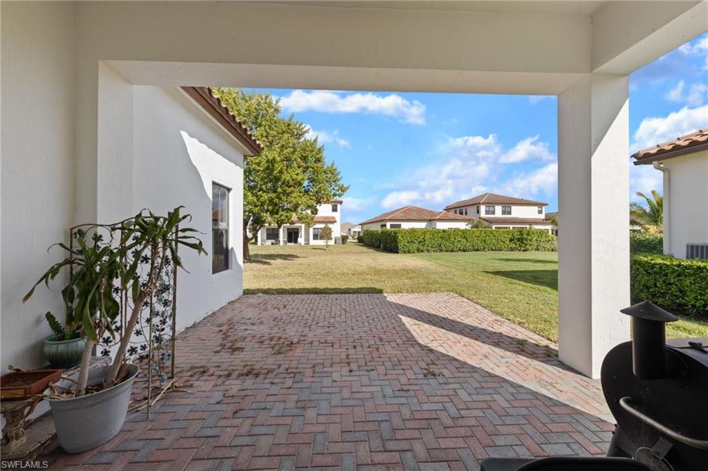 5172 Bergamo Way Ave Maria, FL 34142 - Photo 22 of 33 a view of a porch with furniture and garden