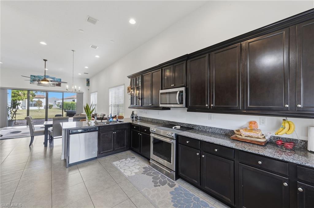 5172 Bergamo Way Ave Maria, FL 34142 - Photo 7 of 33 a kitchen with lots of counter top space and appliances