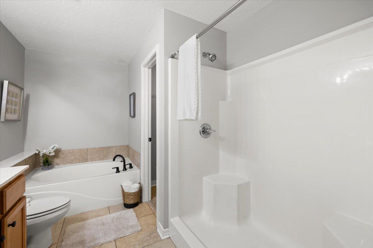 3140 Skyline Drive Crestview, FL 32539 - Photo 16 of 29 a bath room with a toilet and a bath tub