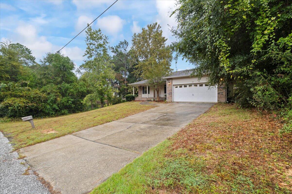 3140 Skyline Drive Crestview, FL 32539 - Photo 2 of 29 a view of house with yard and trees in background