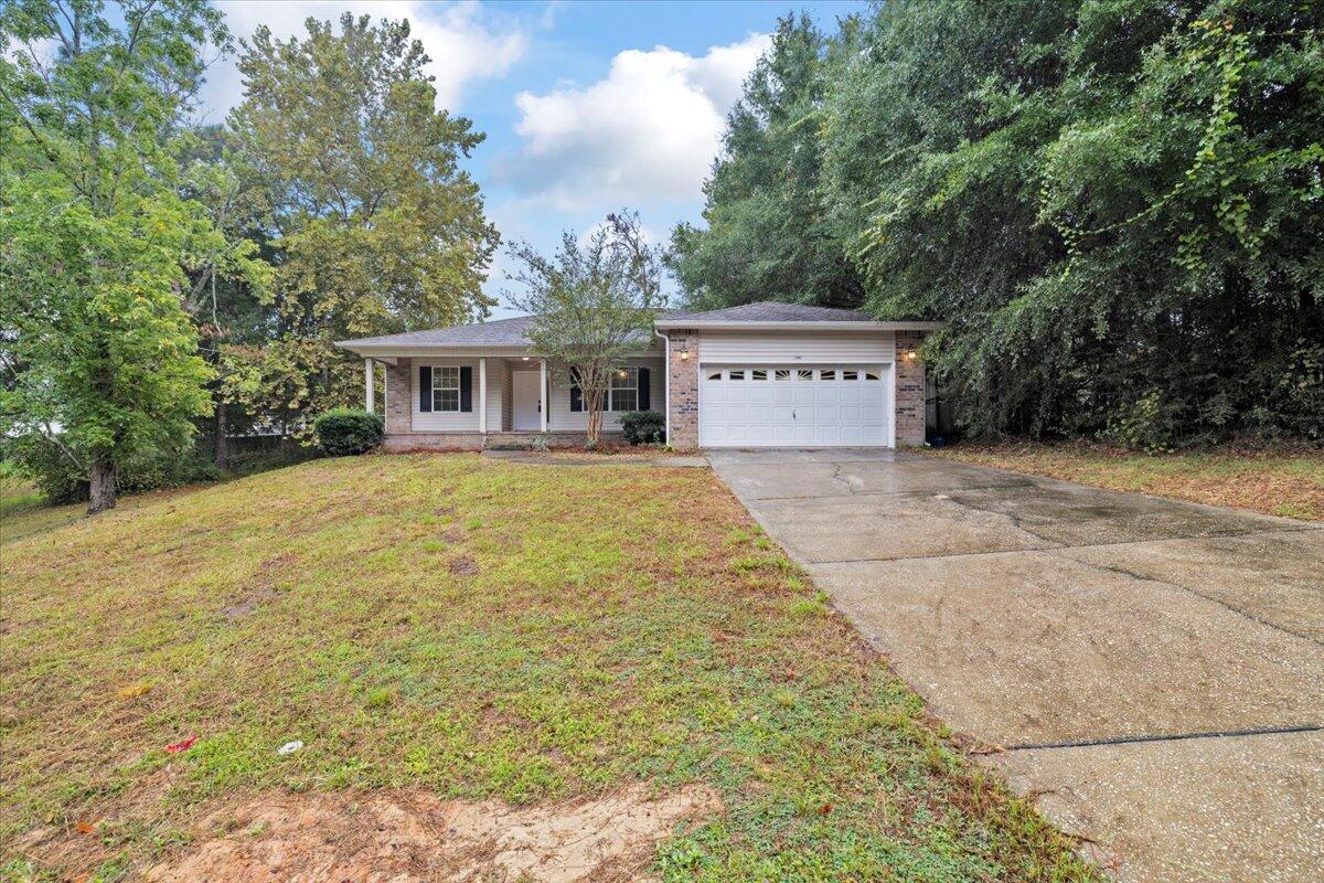 3140 Skyline Drive Crestview, FL 32539 - Photo 4 of 29 a view of house with yard and trees in the background