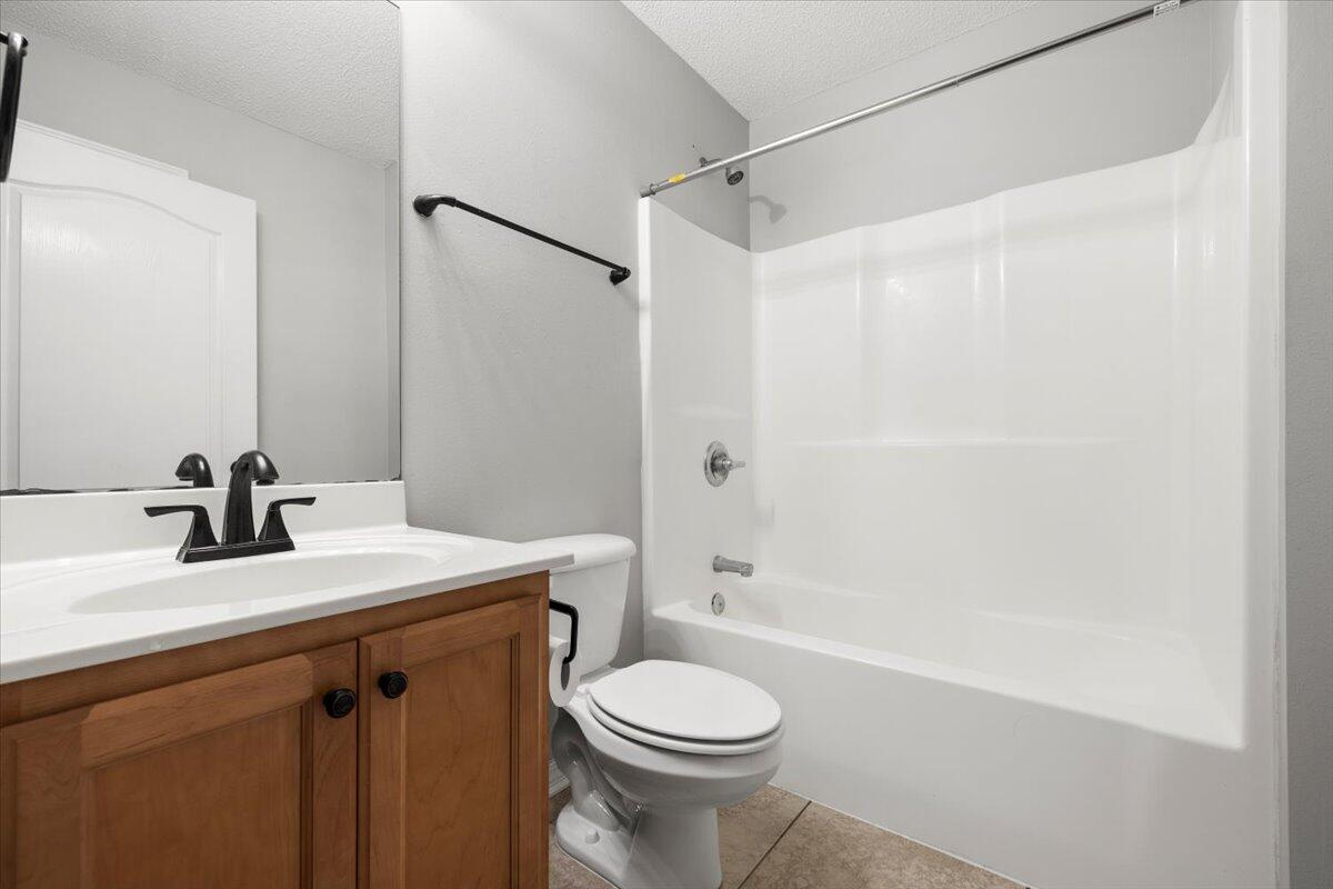 3140 Skyline Drive Crestview, FL 32539 - Photo 10 of 29 a bathroom with a sink a toilet and shower