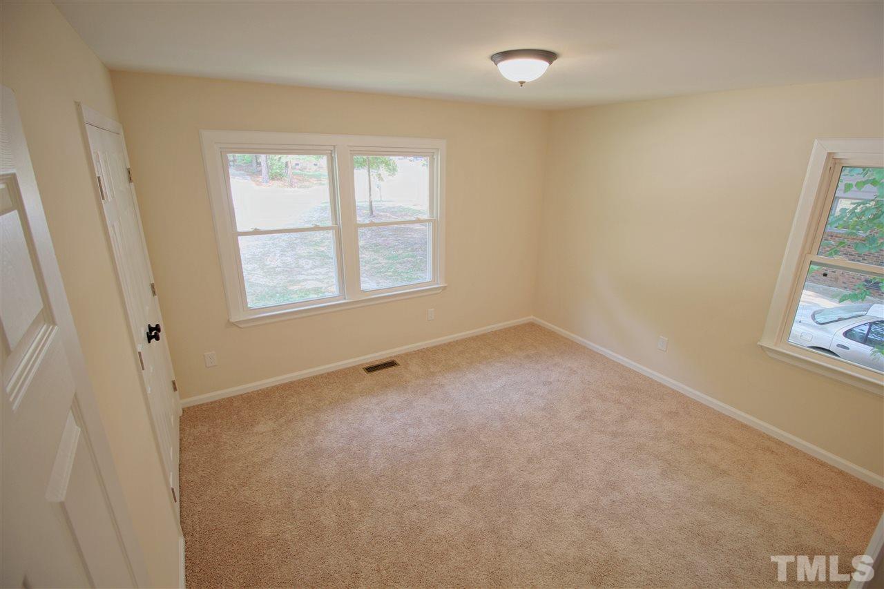 516 Dacian Road Raleigh, NC 27610 - Photo 11 of 16 an empty room with windows