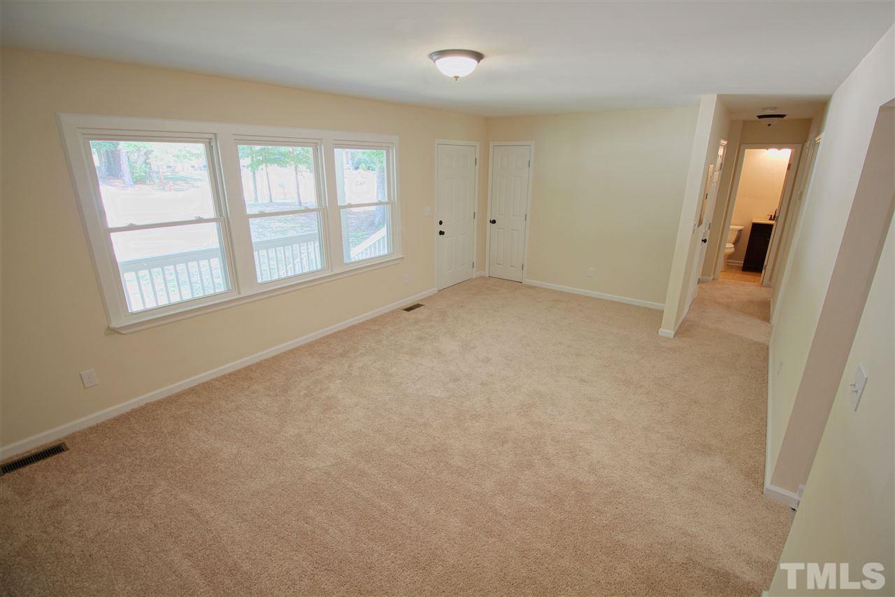 516 Dacian Road Raleigh, NC 27610 - Photo 4 of 16 an empty room with windows