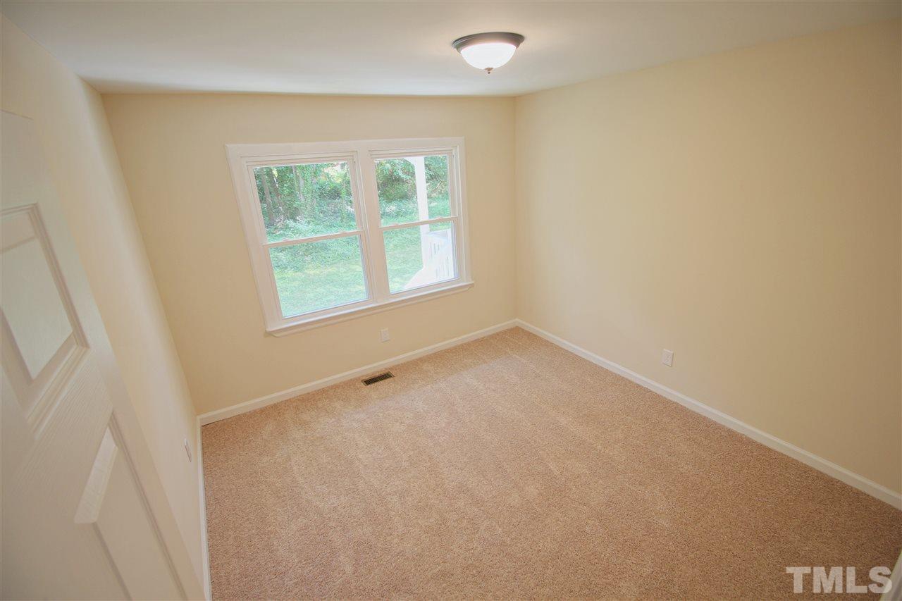 516 Dacian Road Raleigh, NC 27610 - Photo 7 of 16 an empty room with a window