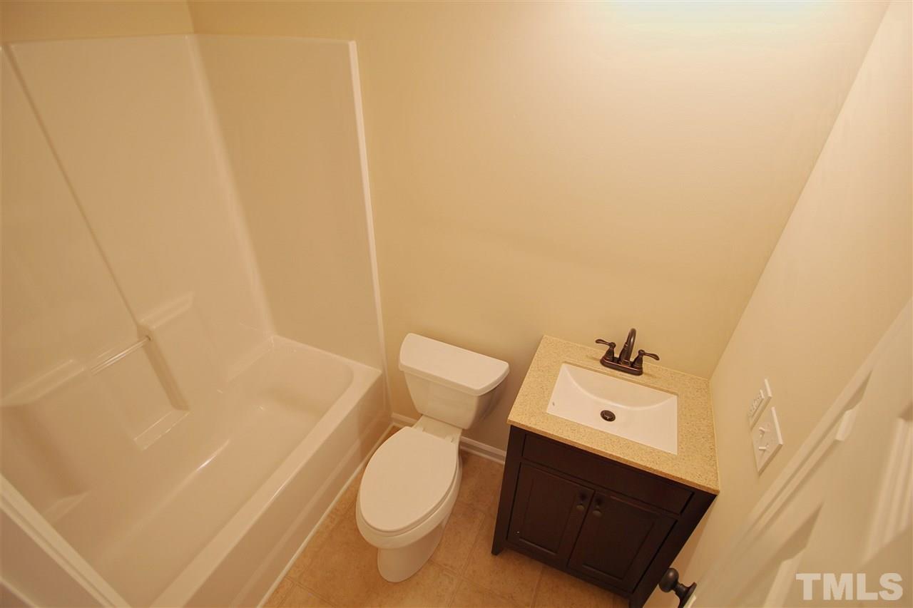 516 Dacian Road Raleigh, NC 27610 - Photo 9 of 16 a bathroom with a sink and toilet