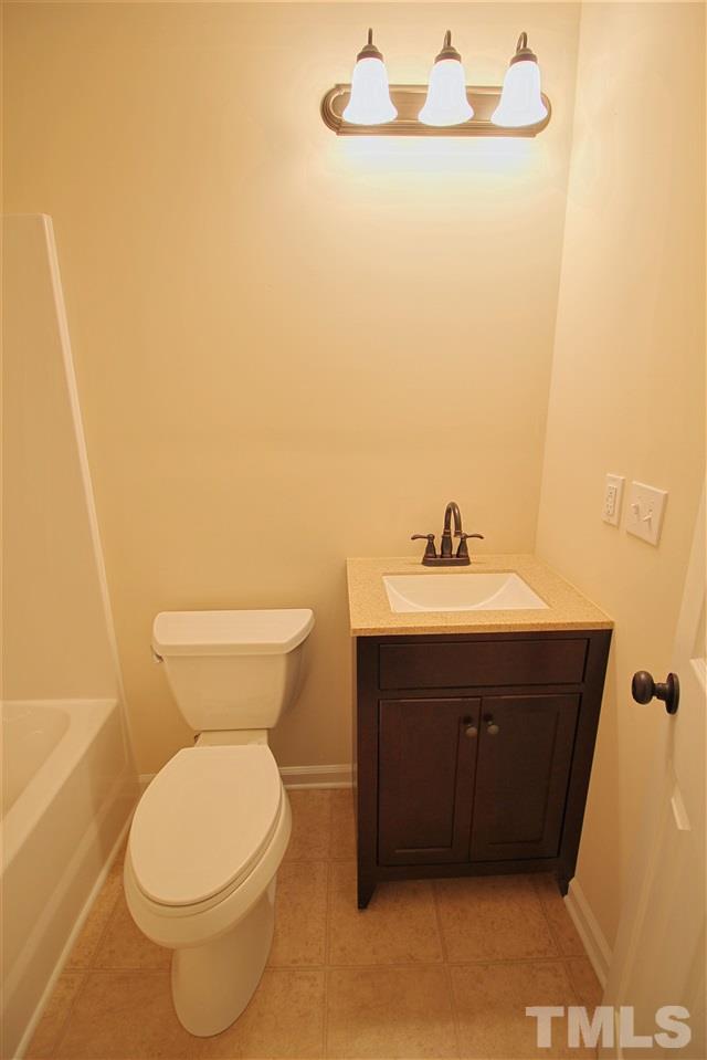 516 Dacian Road Raleigh, NC 27610 - Photo 10 of 16 a bathroom with a sink and a toilet