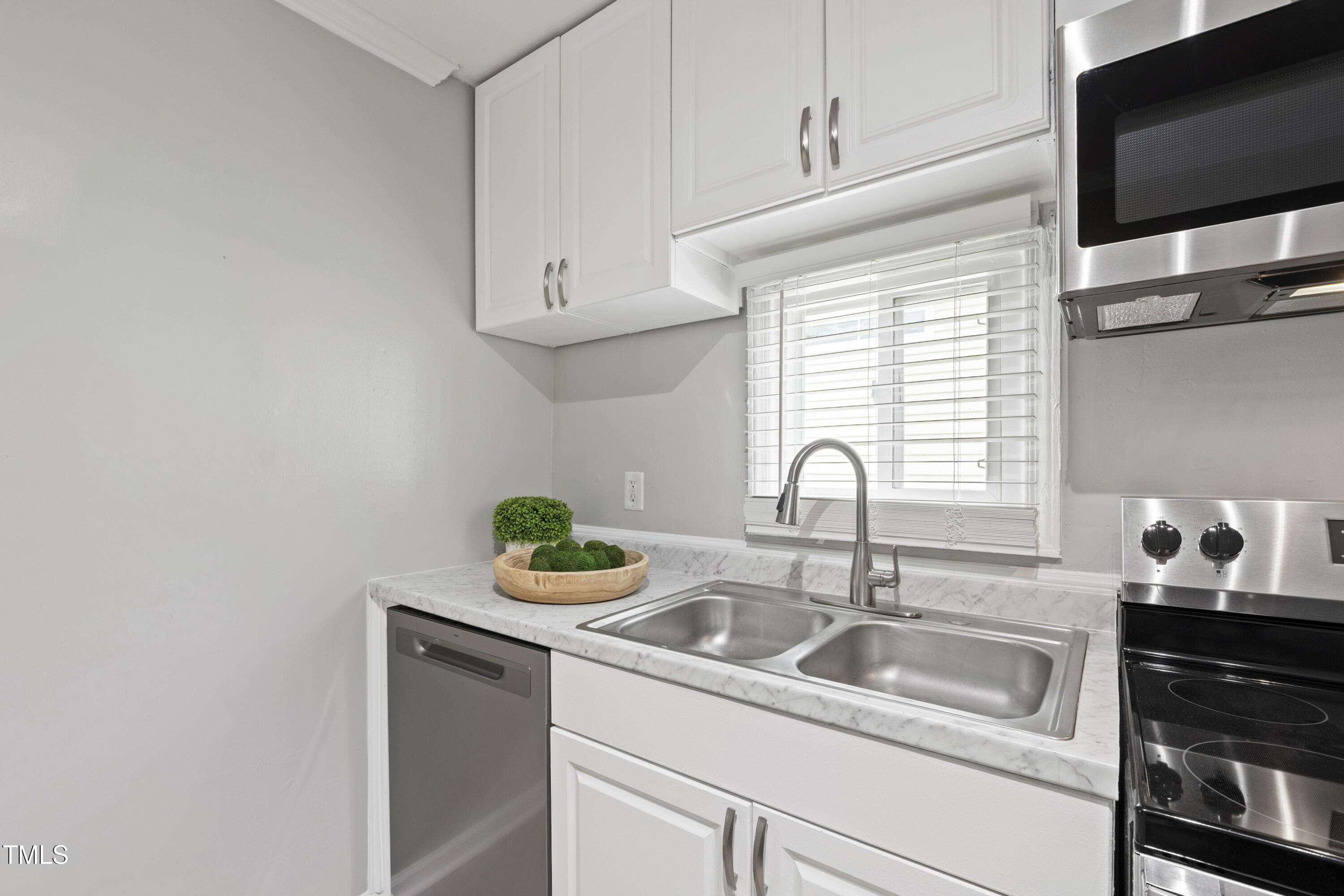 1220 Garner Road Raleigh, NC 27610 - Photo 10 of 26 a close view of sink and tap