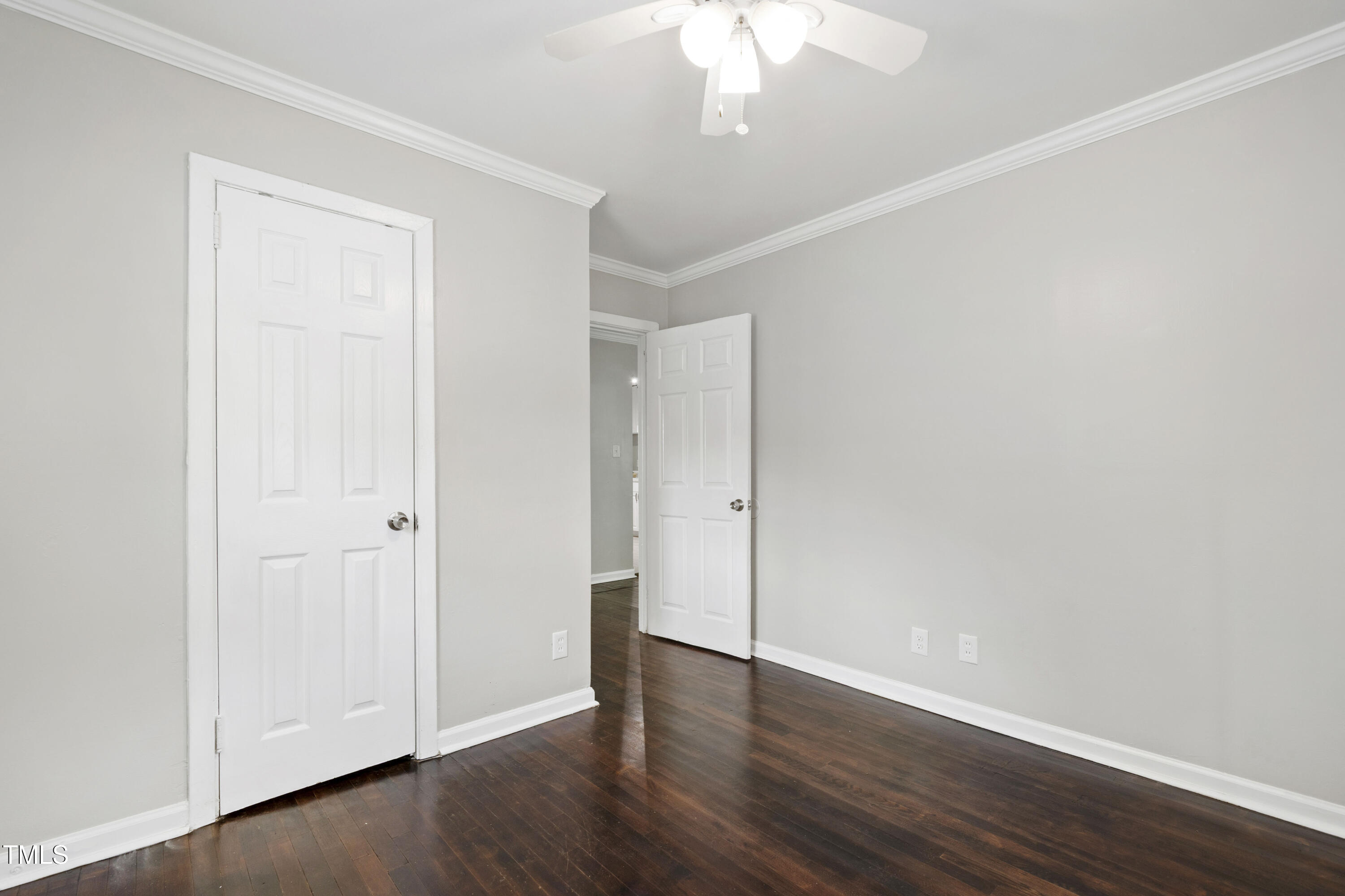 1220 Garner Road Raleigh, NC 27610 - Photo 16 of 26 a view of an empty room with wooden floor