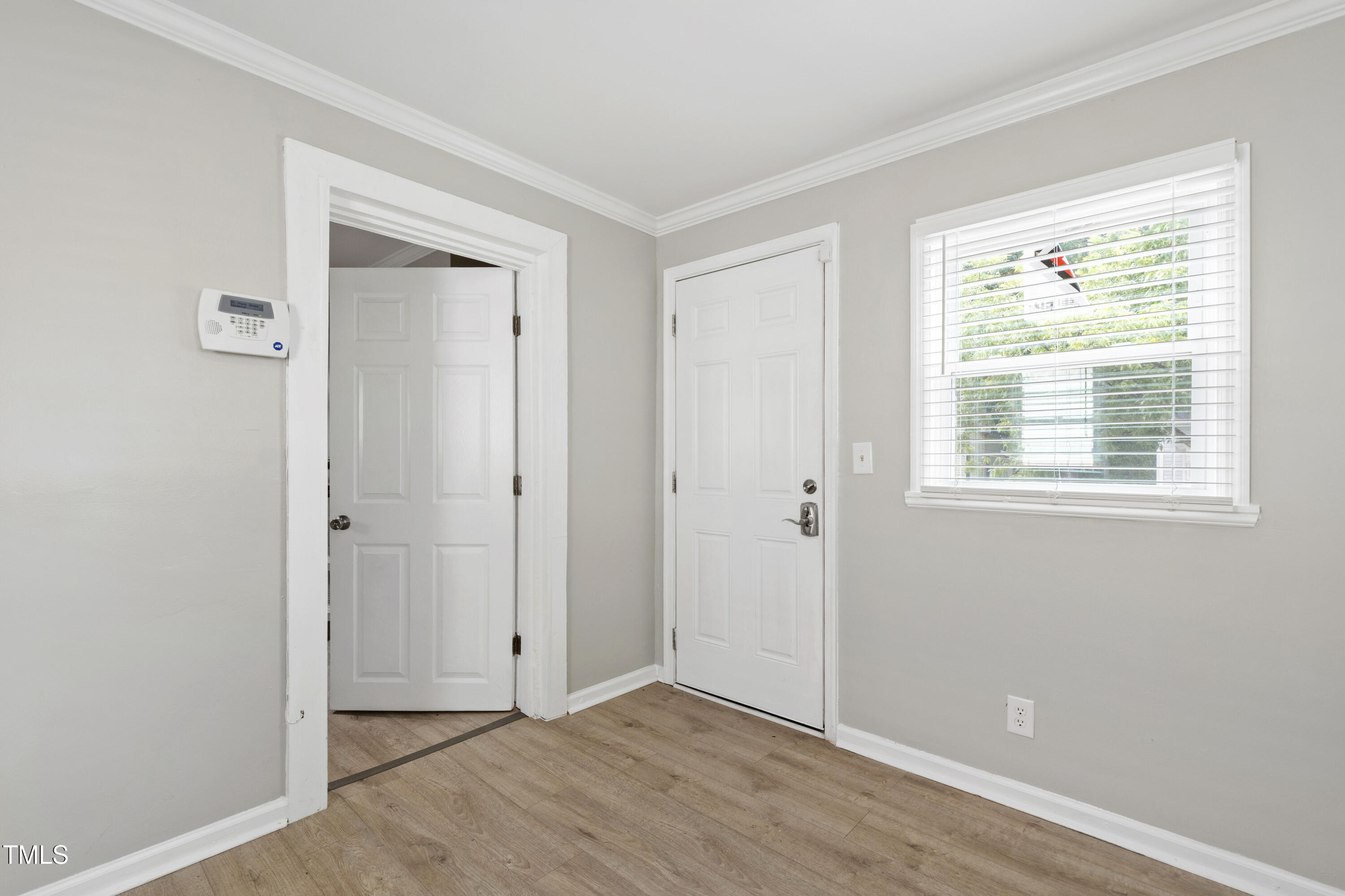 1220 Garner Road Raleigh, NC 27610 - Photo 18 of 26 an empty room with windows and closet