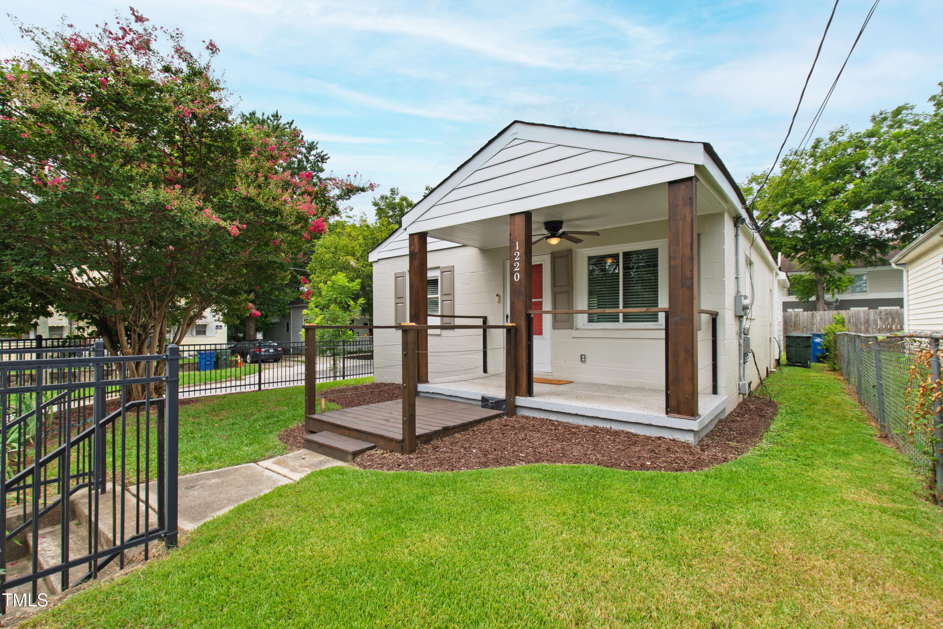1220 Garner Road Raleigh, NC 27610 - Photo 23 of 26 a view of a backyard with a garden and entertaining space