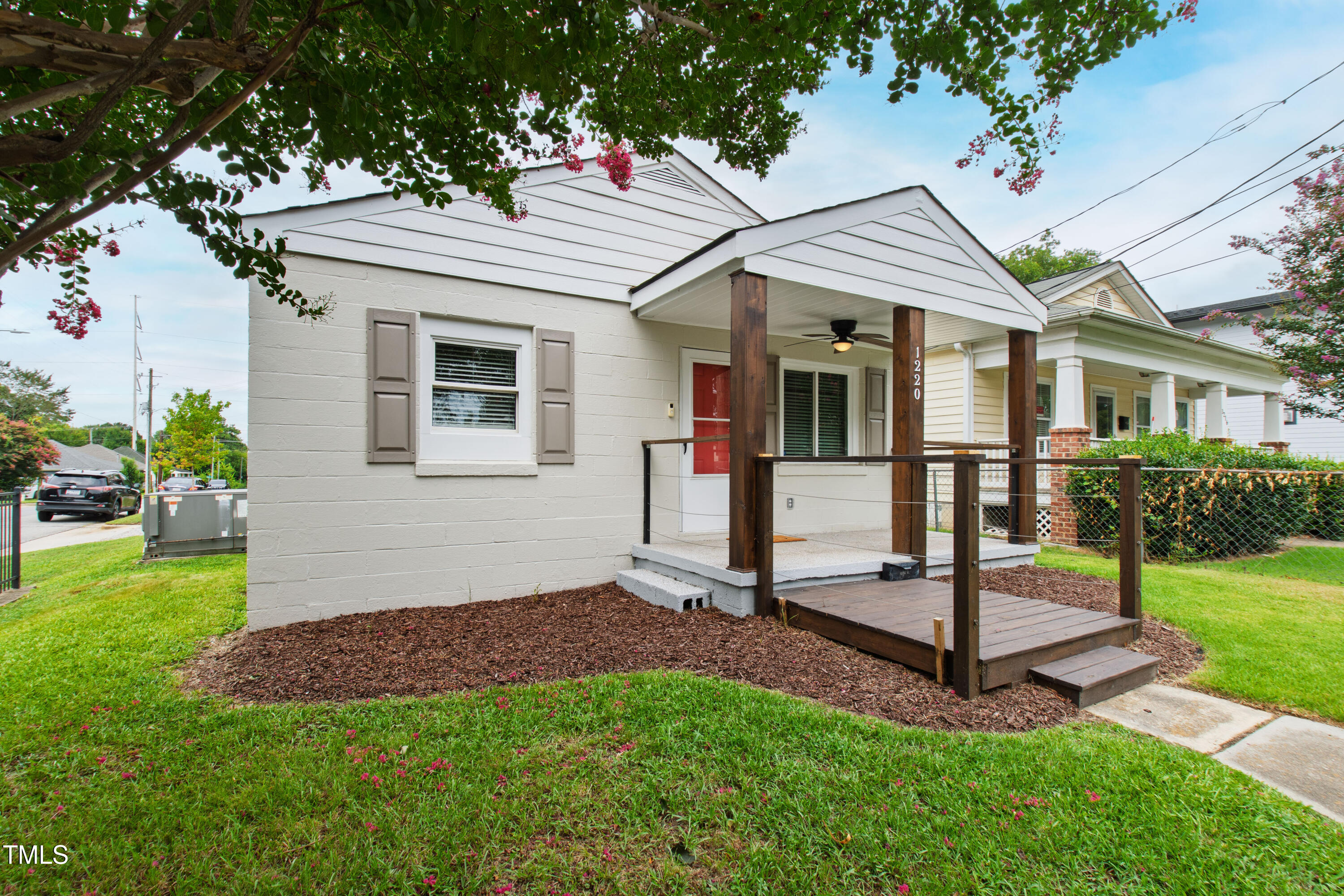 1220 Garner Road Raleigh, NC 27610 - Photo 25 of 26 a view of a house with a yard and porch