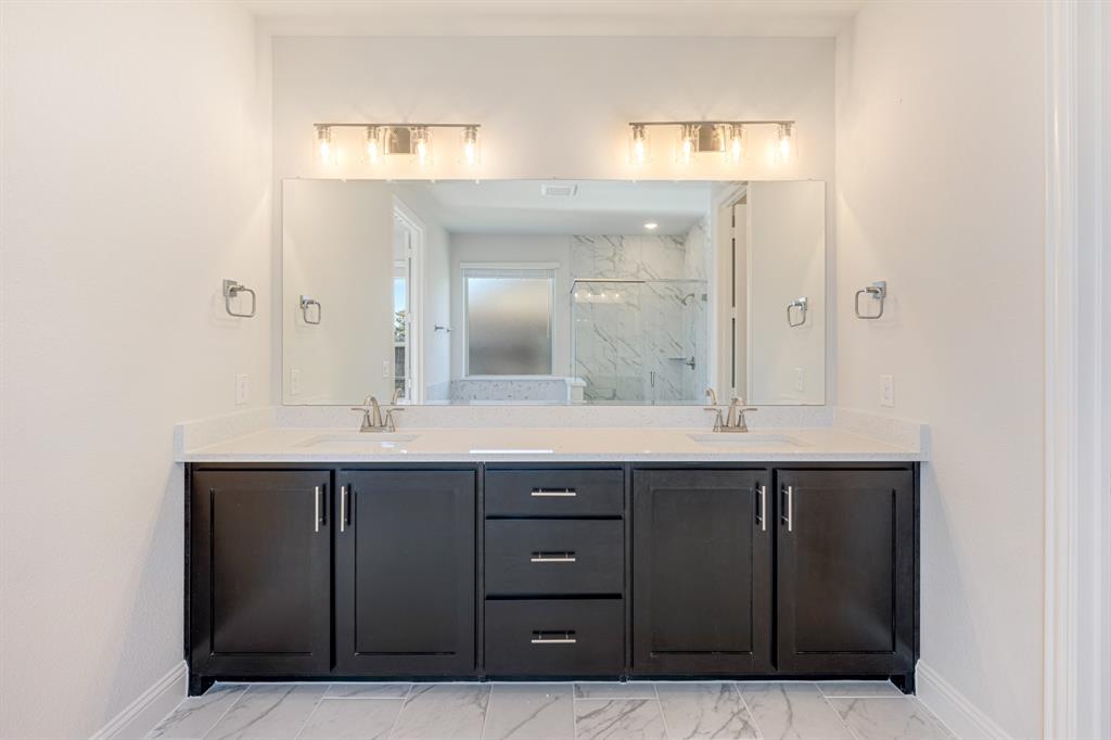 5622 Rowlan Row Midlothian, TX 76065 - Photo 17 of 35 a bathroom with a granite countertop sink and a mirror