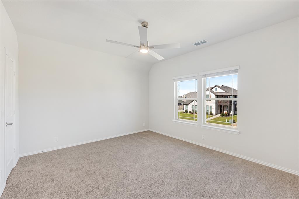 5622 Rowlan Row Midlothian, TX 76065 - Photo 30 of 35 an empty room with a window and ceiling fan