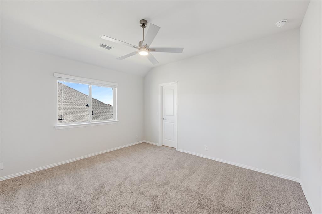 5622 Rowlan Row Midlothian, TX 76065 - Photo 33 of 39 an empty room with a window and ceiling fan