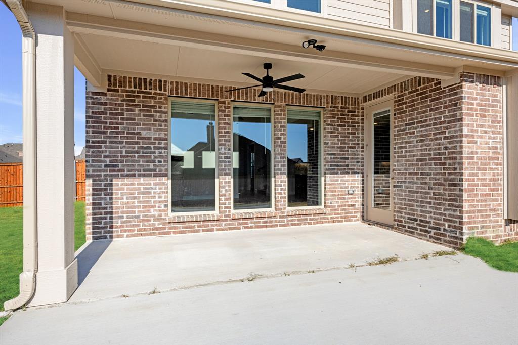 5622 Rowlan Row Midlothian, TX 76065 - Photo 36 of 39 a view of a brick house with a large windows