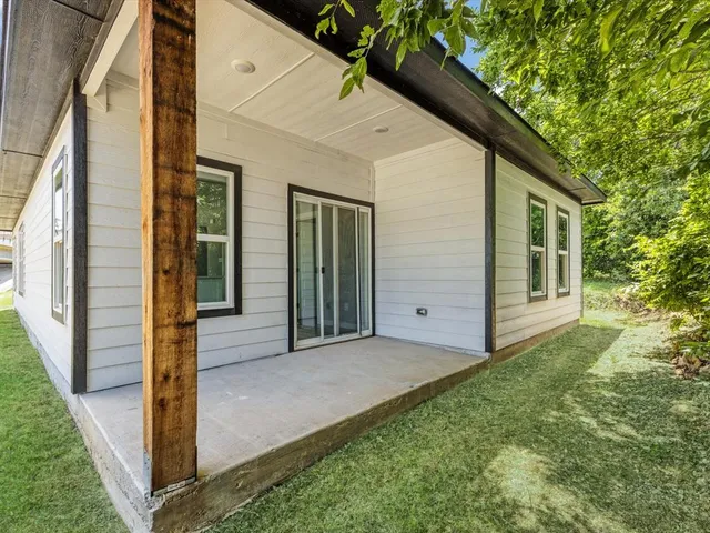 a view of front door and yard