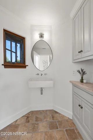 a bathroom with a granite countertop sink a toilet and shower