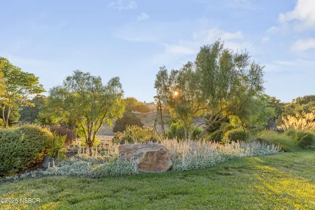a view of a house with swimming pool and porch