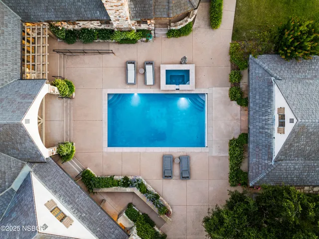 a front view of house with yard and outdoor seating
