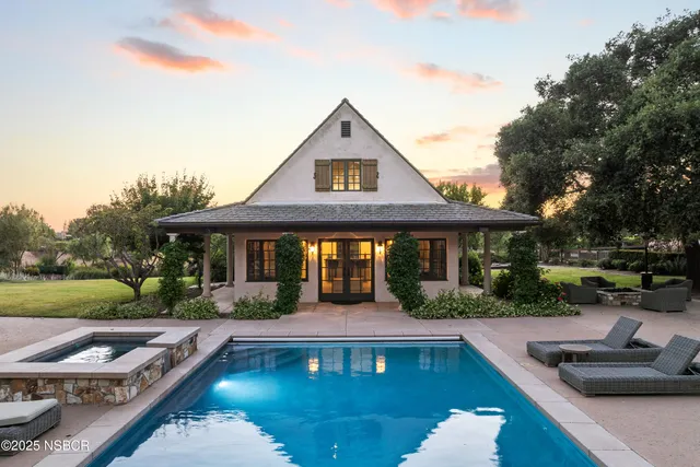 a living room with furniture large window and walk in closet