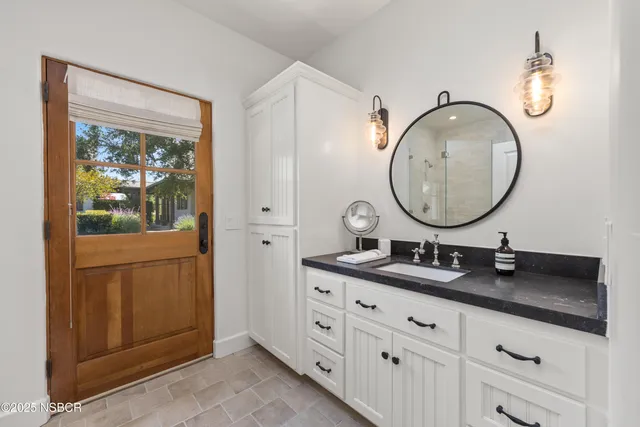 a kitchen with granite countertop a stove and a sink
