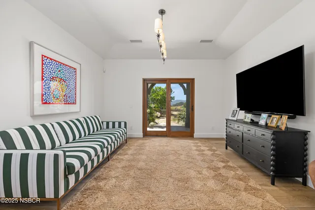 a kitchen with white cabinets and appliances