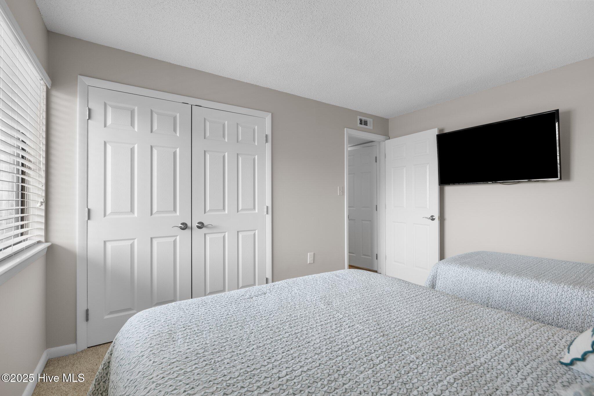 1505 Salter Path Road, Unit 409 Indian Beach, NC 28512 - Photo 24 of 35 Second Bedroom