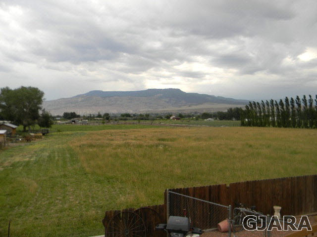 3455 G Road Clifton, CO 81520 - Photo 11 of 28 a view of a lake with a mountain