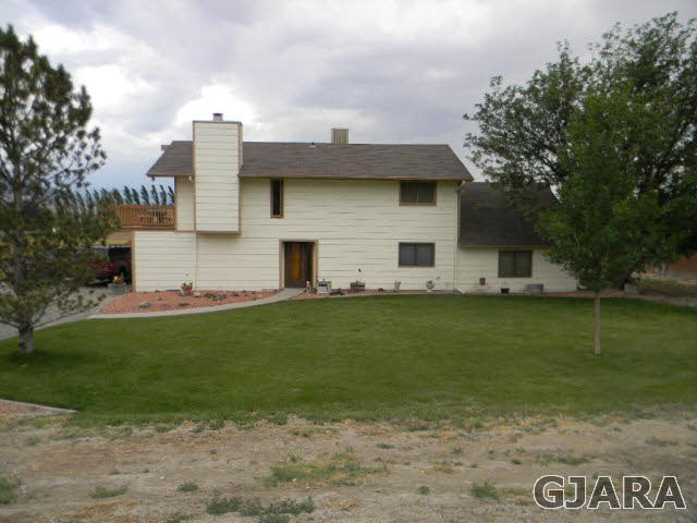 3455 G Road Clifton, CO 81520 - Photo 6 of 28 a view of a house with a yard