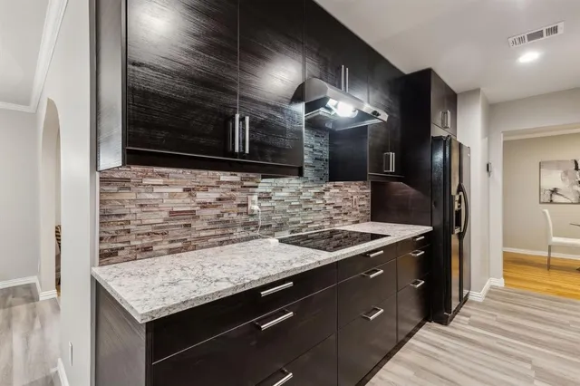 a bathroom with a sink and a large mirror