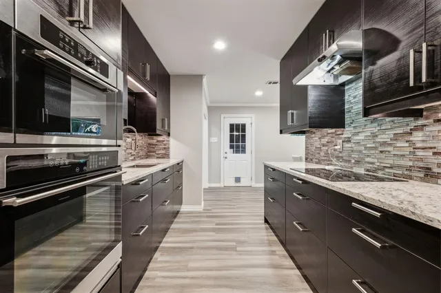 a kitchen with a stove and a microwave