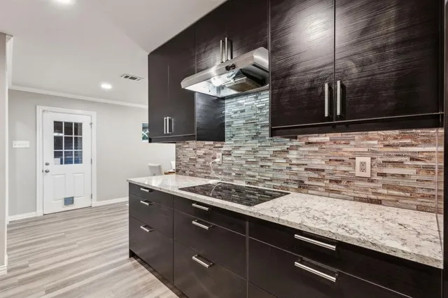 a large kitchen with stainless steel appliances