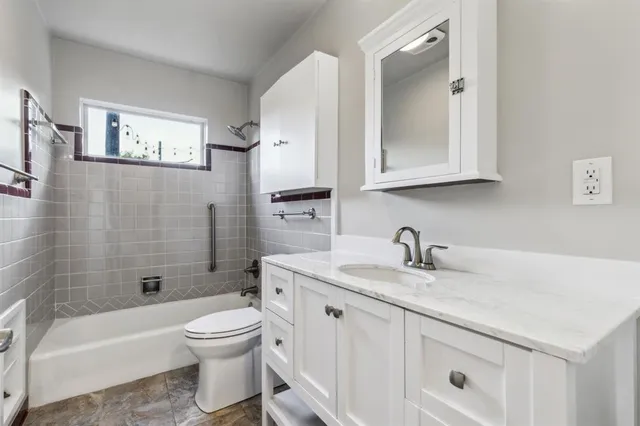 a view of a livingroom with wooden floor and a window