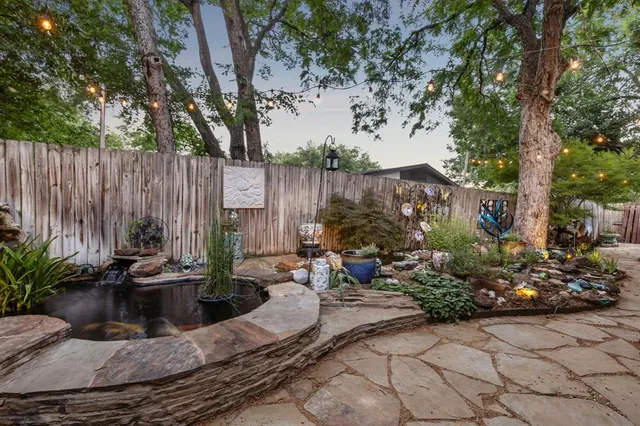 a view of outdoor space with seating area and trees