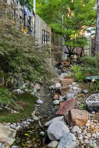 a view of a backyard with sitting area and furniture