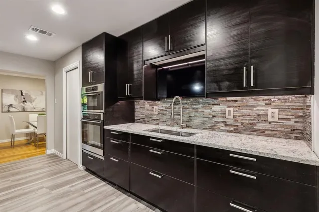 a living room with furniture a lamp and a window