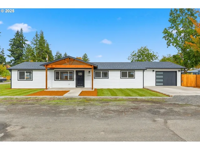a view of pool with a house in the background