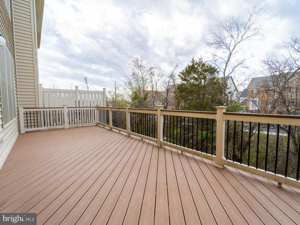 22595 Windsor Locks Square Ashburn, VA 20148 - Photo 54 of 56 a view of a balcony with wooden floor