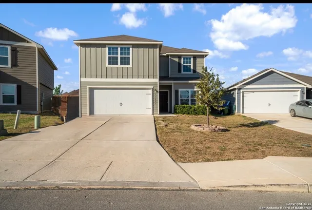 a front view of a house with yard