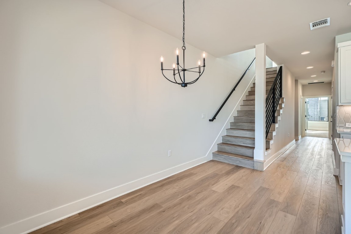 9033 Cattle Baron Path Austin, TX 78747 - Photo 14 of 28 a view of entryway with wooden floor