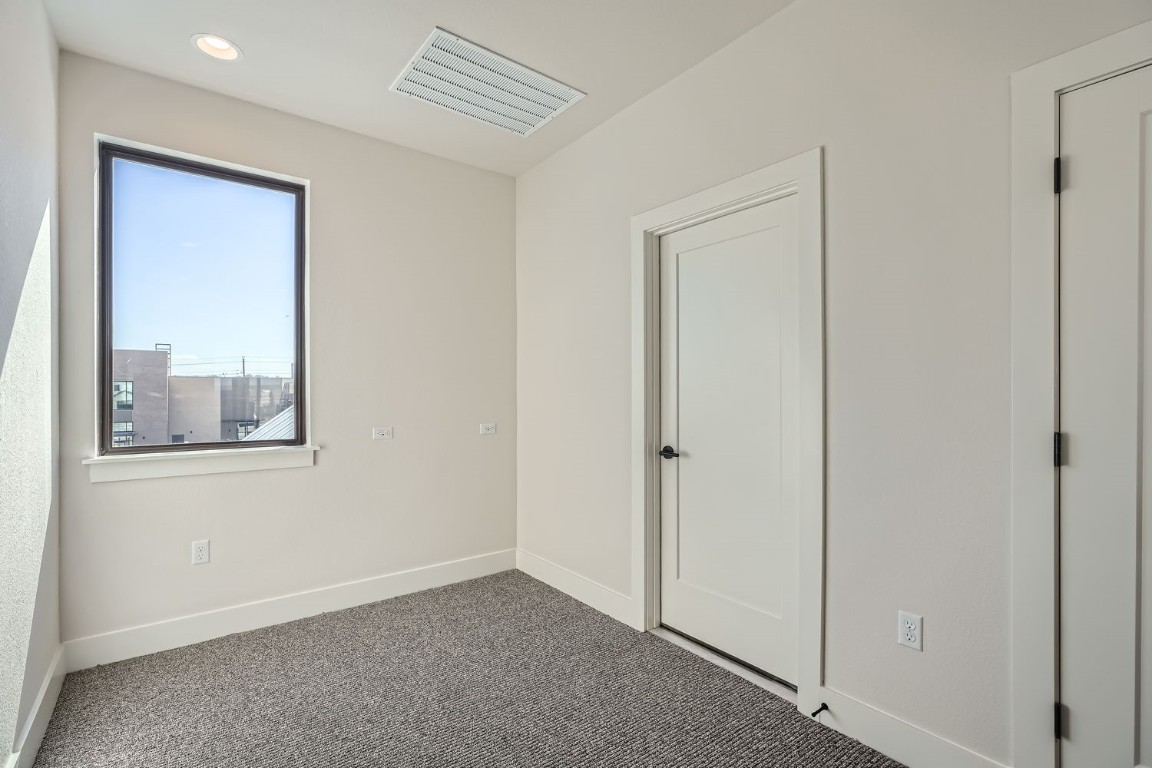 9033 Cattle Baron Path Austin, TX 78747 - Photo 24 of 28 a view of an empty room with closet and a window