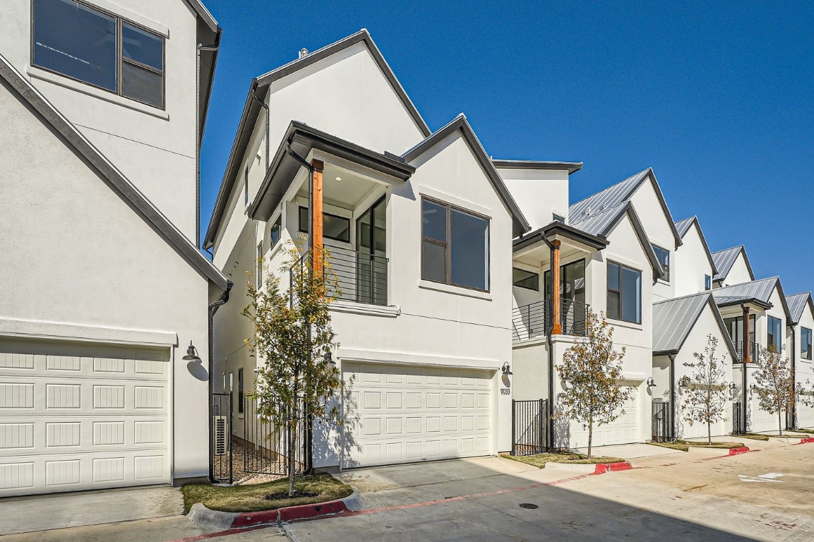 9033 Cattle Baron Path Austin, TX 78747 - Photo 27 of 28 a front view of a house with a street