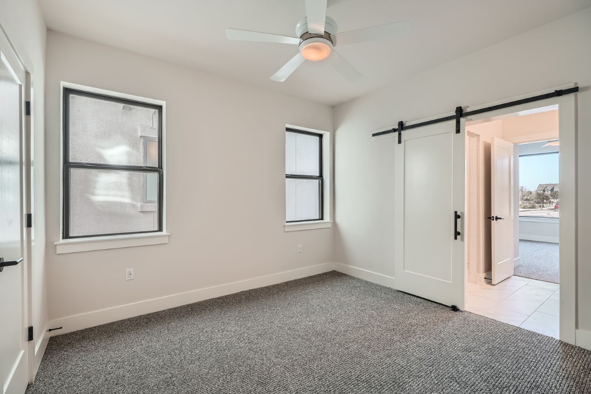 9033 Cattle Baron Path Austin, TX 78747 - Photo 9 of 28 an empty room with windows and closet