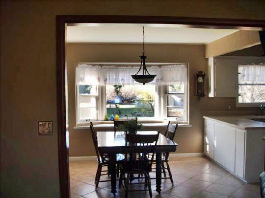 4051 Rotary Road Rockford, IL 61109 - Photo 9 of 9 a dining room with furniture a chandelier and window