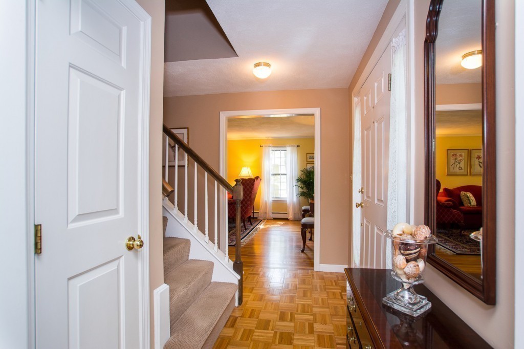 21 Lee Road Medfield, MA 02052 - Photo 13 of 30 a view of a hallway view with wooden floor and living room